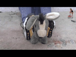 Stuffed Toy Under Spike Running Shoes